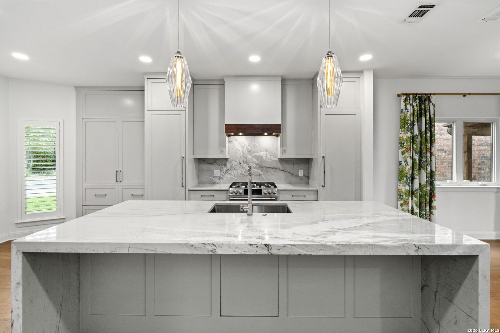 OPEN HOUSE THURSDAY MAY 7, 4:00-6:00!!  Notice all of the detail of this spectacular home with iconic Quarry views! Beautifully remodeled in 2023. Bright, open floor plan with family room + primary suite opening to nicely landscaped back yard for entertaining and beautiful sunsets. Chef's kitchen with an exquisite waterfall island, custom cabinetry, a built-in fridge/freezer, gas cooking, double ovens and breakfast nook. Bar close by for easy entertaining. Upstairs loft offers flex space plus two bedrooms and bull bath. Conveniently located with premier shopping and dining nearby.