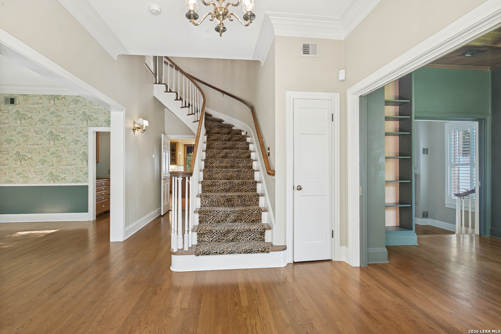 Nestled on one of the most desirable streets in Terrell Hills, this traditional brick home offers timeless architecture, generous living spaces, and an exceptional setting on approximately 0.4 acres. Mature shade trees and established landscaping create a welcoming first impression, while a circular drive and rear-entry garage preserve the home's elegant curb appeal. Inside, classic design elements blend seamlessly with comfortable everyday living. The entry is anchored by a graceful staircase, rich wood floors, and a beautifully appointed powder bath tucked beneath the stairs. A formal dining room featuring built-in china cabinets and designer wallpaper provides an inviting space for entertaining, while a library just off the entry offers flexibility as a study, sitting room, or home office. The spacious living room serves as the heart of the home, highlighted by a handsome wood mantel fireplace, plantation shutters, and French doors that frame picturesque views of the backyard and pool. The adjacent kitchen is thoughtfully positioned at the rear of the home and features an island with smooth cooktop, double ovens, stainless steel appliances, wine refrigerator, breakfast area, and a window overlooking the pool. A utility room with direct backyard access adds convenience to daily living. Upstairs, all three bedrooms feature ensuite bathrooms and walk-in closets, providing privacy and comfort for family and guests alike. The primary suite is a true retreat, complete with a fireplace, private balcony overlooking the pool and grounds, dual walk-in closets, separate tub and shower, and abundant natural light. A dedicated study connected to the primary suite creates the ideal space for a private office, reading room, or work-from-home environment. A finished third-floor attic flex space offers additional versatility and could serve as a playroom, media room, exercise space, hobby room, or additional office. The backyard is designed for both relaxation and entertaining, featuring a swimming pool, spacious patio areas, detached garage, and a separate casita that provides valuable flexibility for guests, extended family, a home office, or creative studio space. Ideally located in the heart of Terrell Hills, this home offers convenient access to downtown San Antonio, the San Antonio International Airport, the San Antonio Zoo, the Pearl, the AT&T Center, premier dining, shopping, and cultural attractions. Located within the highly sought-after Alamo Heights Independent School District, this property combines classic Terrell Hills character, generous square footage, multiple living spaces, a casita, pool, and an exceptional location in one of San Antonio's most desirable neighborhoods.