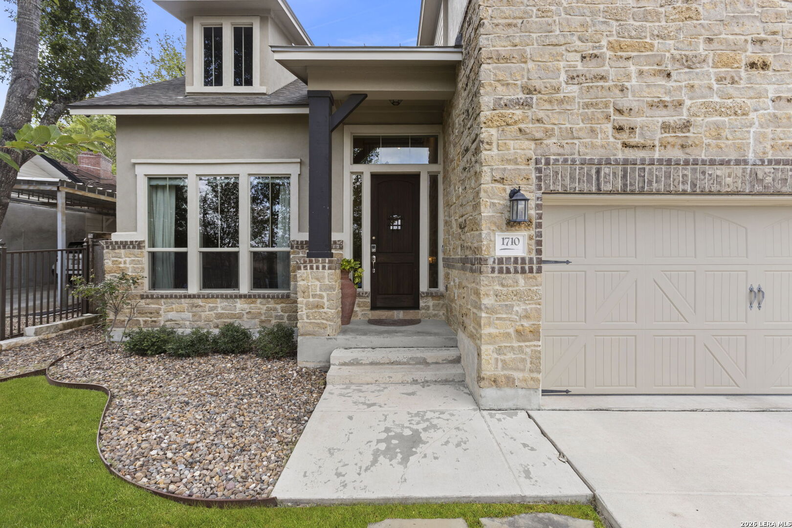 Timeless design and thoughtful functionality come together in this beautifully appointed four-bedroom, three-and-a-half-bath residence. Offering approximately 3,000 square feet, the gracious layout creates an effortless balance between everyday comfort and refined entertaining.  At the heart of the home, an open-concept kitchen, breakfast area and family room provide an inviting gathering place with a natural sense of connection. A versatile main-level flex space offers endless possibilities as a formal dining room, private study, additional sitting area or playroom. Privately positioned on the first floor, the spacious primary suite provides a peaceful retreat separate from the secondary bedrooms.  Upstairs, a generous additional family room anchors three additional bedrooms and two full bathrooms, offering ample space for guests, recreation and work. Outside, beautifully landscaped grounds, a fully enclosed front yard and an electric gate enhance the home's curb appeal, privacy and functionality. The expansive outdoor space also presents an exceptional opportunity to add a pool, cultivate a garden or create additional areas for entertaining.  All within Alamo Heights ISD and conveniently located near the Broadway corridor, the Pearl, celebrated local favorites and everyday conveniences, this distinctive home offers a refined lifestyle in one of San Antonio's most desirable areas.
