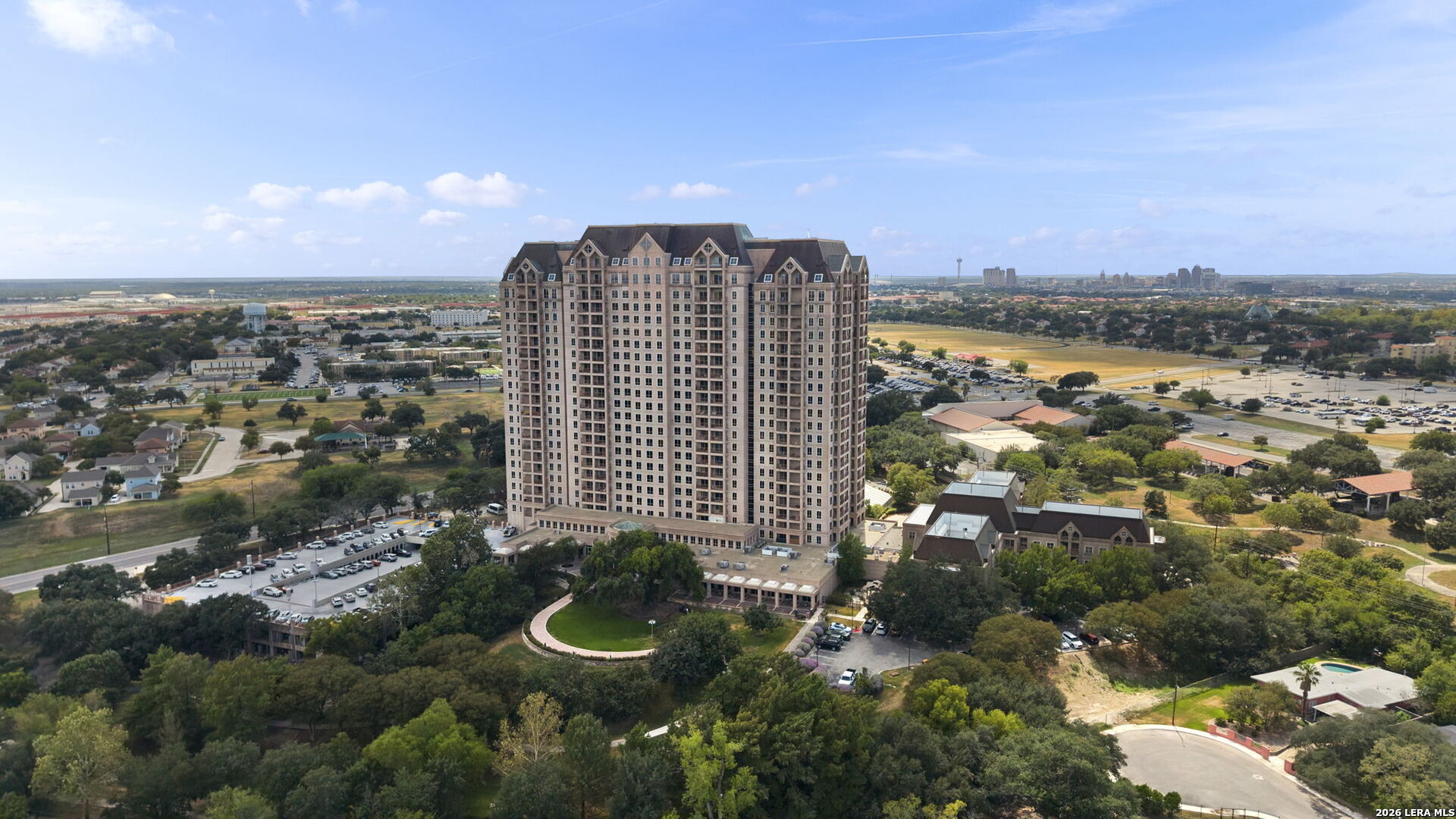 OPEN HOUSE OCT 8 FROM 2-4:30 Luxury High-Rise Cooperative Living in San Antonio! Welcome to The Towers on Park Lane, a resident-governed 55+ cooperative community offering exceptional services, amenities, dining, recreation, and social opportunities with many of the conveniences of a luxury hotel. A Rare Residence. An Exceptional Lifestyle. This beautifully renovated "M" residence is one of only two of its kind in the building, offering a unique corner floor plan with generous living spaces, beautiful views, and thoughtful updates throughout. Features include an updated kitchen with custom cabinetry, a butler's bar w beverage cooler, three full baths, beautiful hardwood parquet floors, abundant storage, and an open living and dining area ideal for entertaining. The spacious primary suite is privately separated from the second primary suite, with a third bedroom that can also serve as an office. The residence features its own laundry room with additional utility storage. Large windows with plantation shutters and electronic shades fill the home with natural light, while two double balconies along the corner of the building provide additional outdoor living space and impressive views. The Towers offers a lifestyle centered around comfort, convenience, and exceptional service. Valet attendants are available to park your vehicle and assist with personal items, while concierge services help make everyday living easier. Enjoy chef-prepared meals in the elegant white-tablecloth dining room, visit the casual Bistro for breakfast, lunch, or a light bite, or order room service and dine in the comfort of your residence. Amenities include a heated indoor pool and spa, fitness center with personal training and group classes, locker rooms, two libraries, card room, billiards, art studio, business center, woodworking shop, meeting and banquet rooms, chapel, EV charging stations, and approximately 4.5 acres of beautifully maintained grounds with walking trails, patios, gathering areas, and personal gardening beds. The on-site chapel hosts two Sunday morning gatherings each week, offering residents another opportunity to connect within the community. Club 22, an inviting oak-paneled lounge on the 22nd floor, features expansive windows and balconies overlooking the downtown San Antonio skyline. Beyond the extensive amenities, residents enjoy a close-knit community with a variety of opportunities to gather, connect, and participate in activities throughout the year. The building truly becomes an extension of your personal living space. The monthly cooperative fee includes housekeeping every other week, Wi-Fi and cable TV, water and garbage service, concierge and valet services, scheduled transportation, secured covered parking with direct building access, fitness programs, and a variety of recreational, educational, cultural, and social programs. Additional features include 24-hour security and surveillance, monitored fire and sprinkler systems, and a monitored resident assistance system within each residence. Conveniently located near Fort Sam Houston, with easy access to nearby military and medical facilities, The Towers on Park Lane combines luxury high-rise living, extensive amenities, and everyday conveniences in one distinctive San Antonio community.